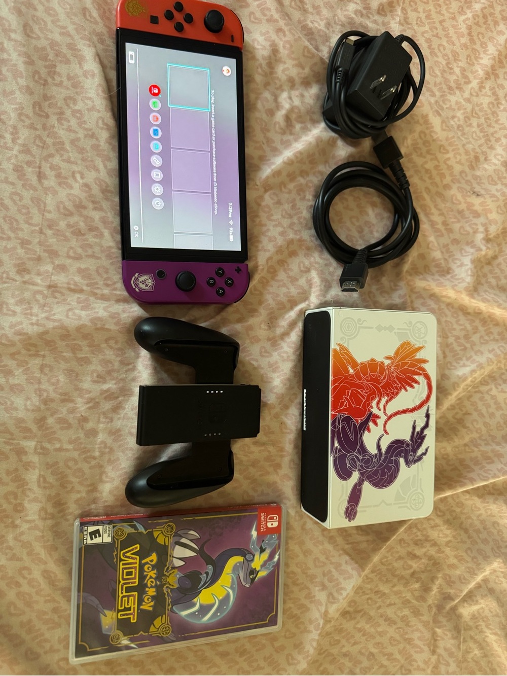 Nintendo Switch OLED with Red and Purple Joy-Con and Pokémon Violet Dock Art